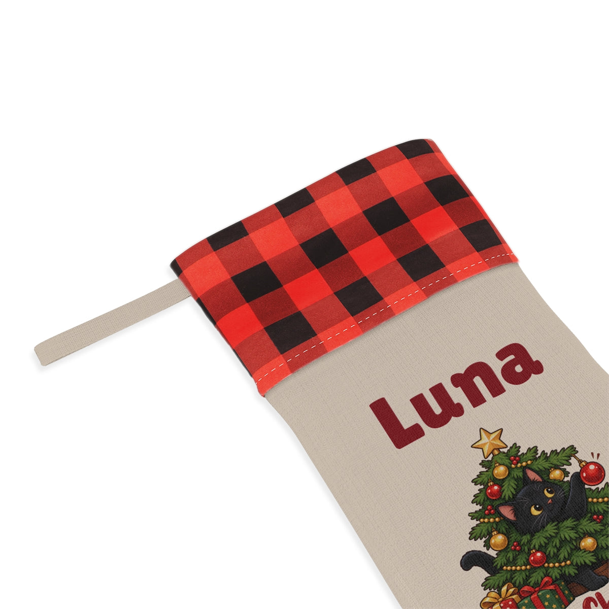 Close-up of the printed name Luna under the red plaid cuff