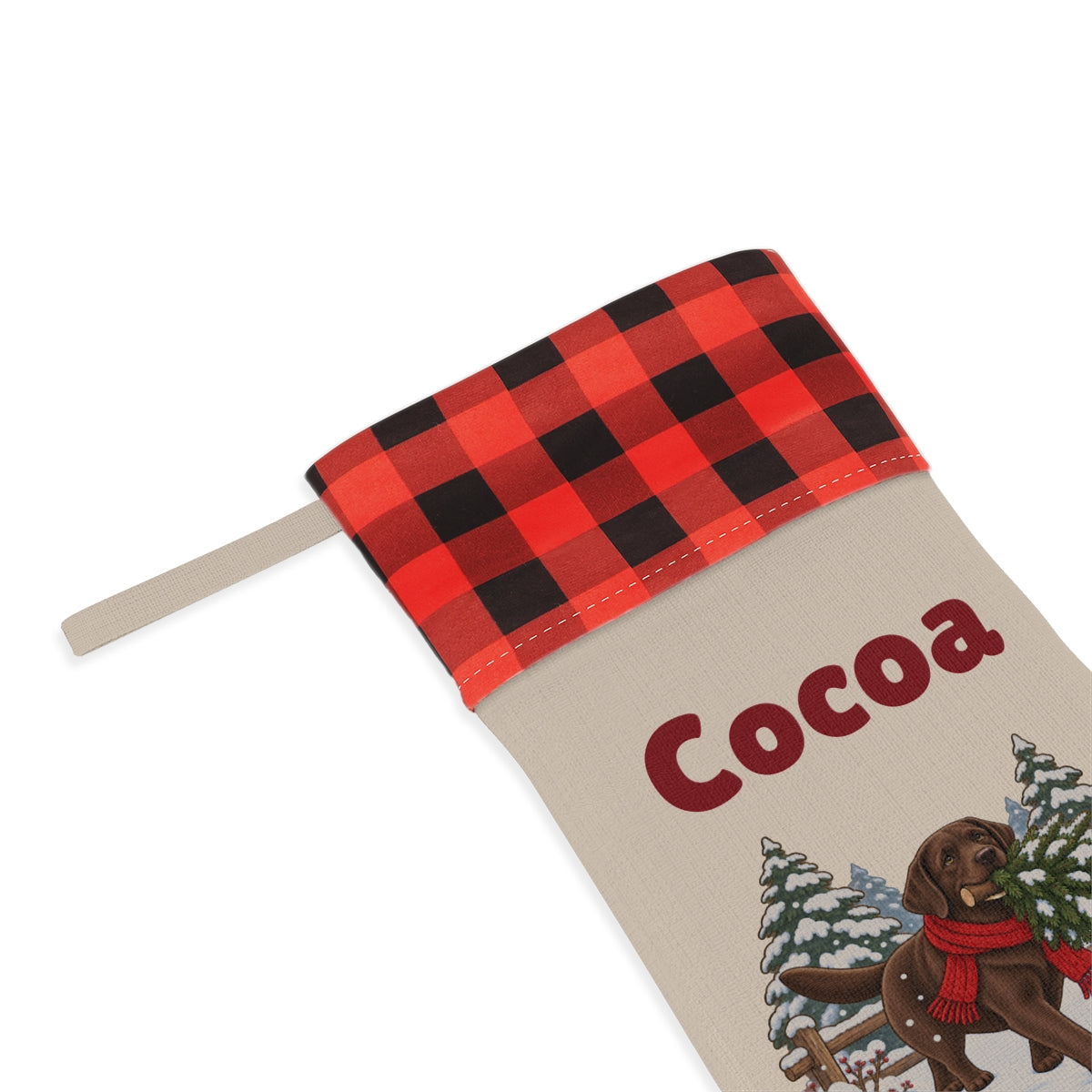 Close-up of the printed name Cocoa under the red plaid cuff