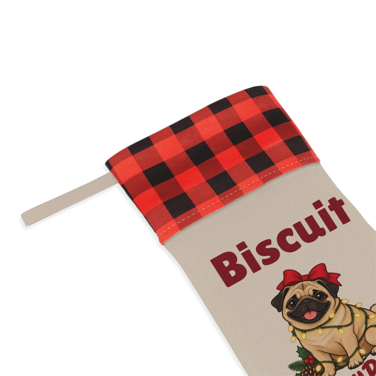 Close-up of the printed name Biscuit under the red plaid cuff