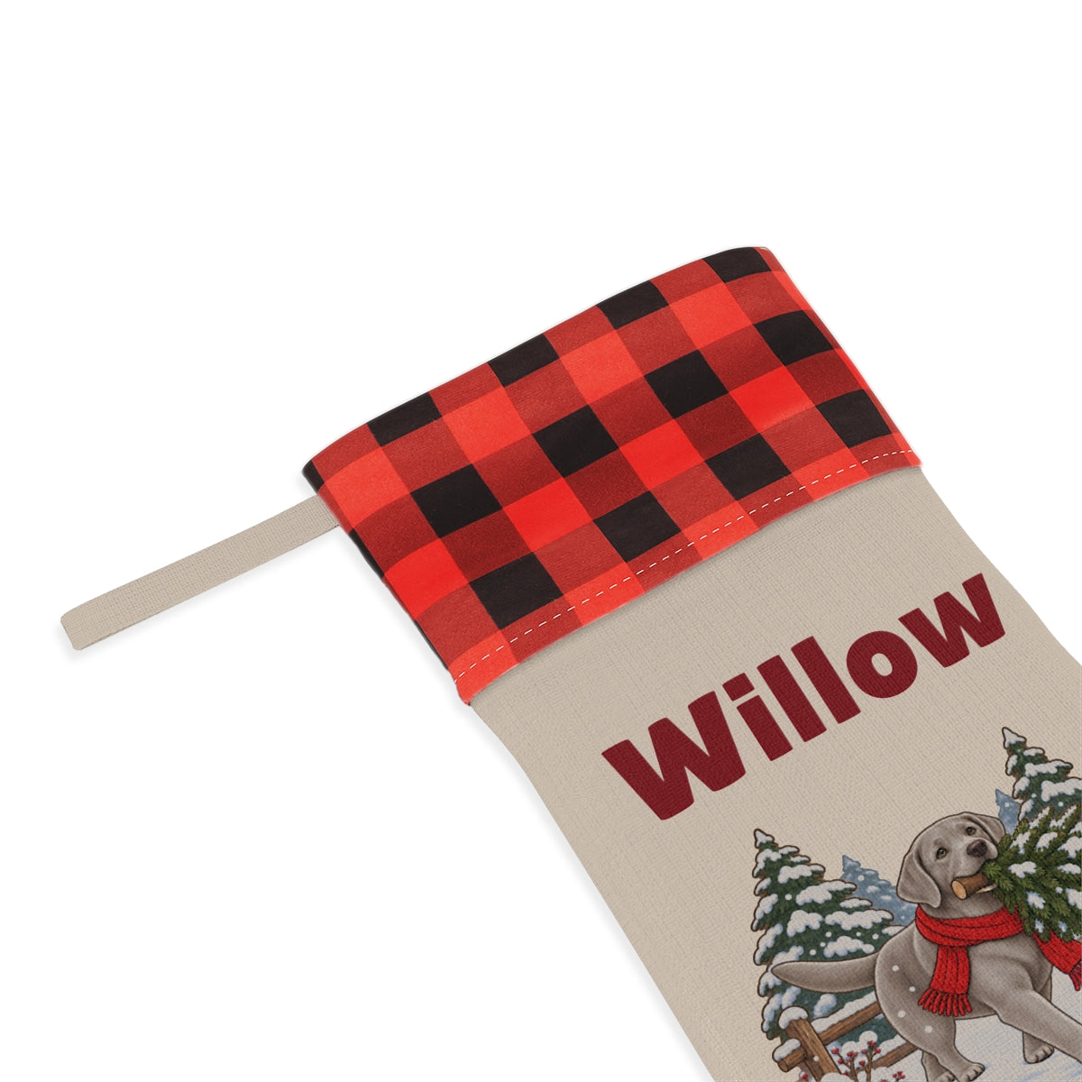 Close-up of the printed name Willow under the red plaid cuff