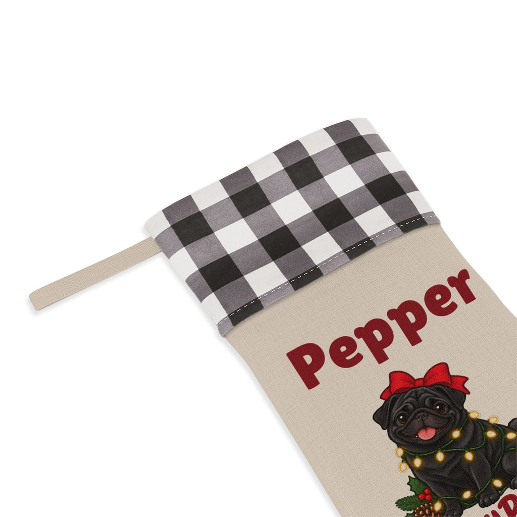 Close-up of the name under the white plaid cuff