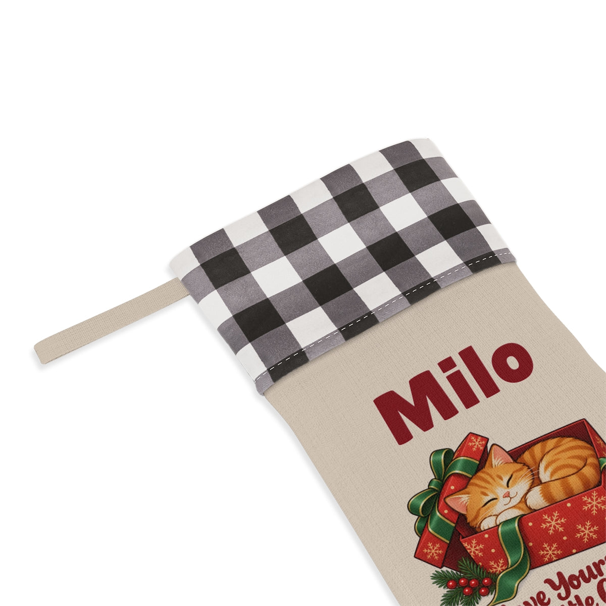 Close-up of the name under the white plaid cuff