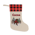Personalized Chocolate Lab Christmas Stocking with a red and black buffalo plaid cuff, personalized with the sample name Cocoa