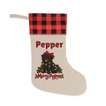 Personalized Black Pug Christmas Stocking with a red and black buffalo plaid cuff, personalized with the sample name Pepper