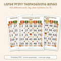 Three printable large print Thanksgiving bingo cards with big numbers 1 to 75 and autumn leaves on the grid, by Winter Wren. Digital download; nothing is shipped.